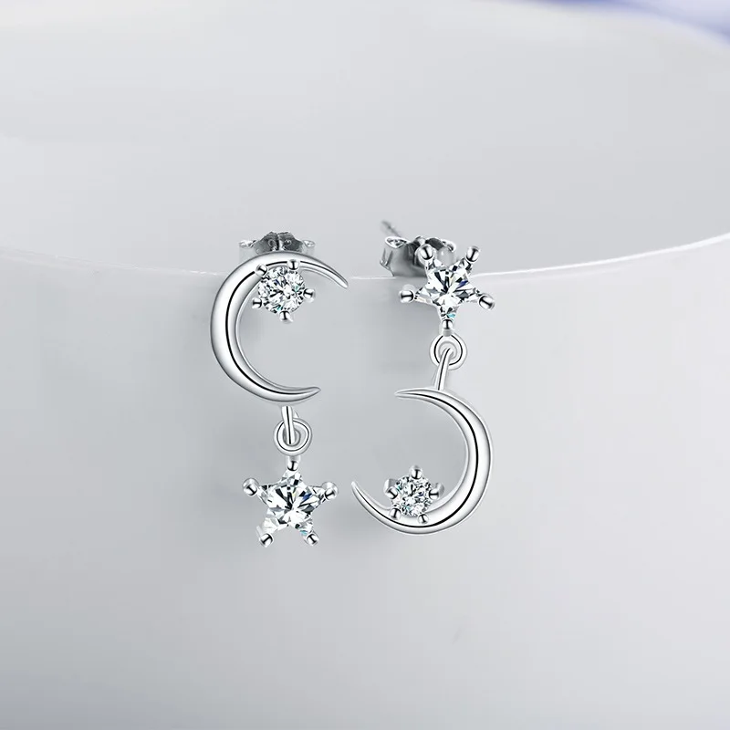 Korean version asymmetrical star and moon stud earrings made of S925 silver with fine inlays. Women's earrings. Anti-allergic