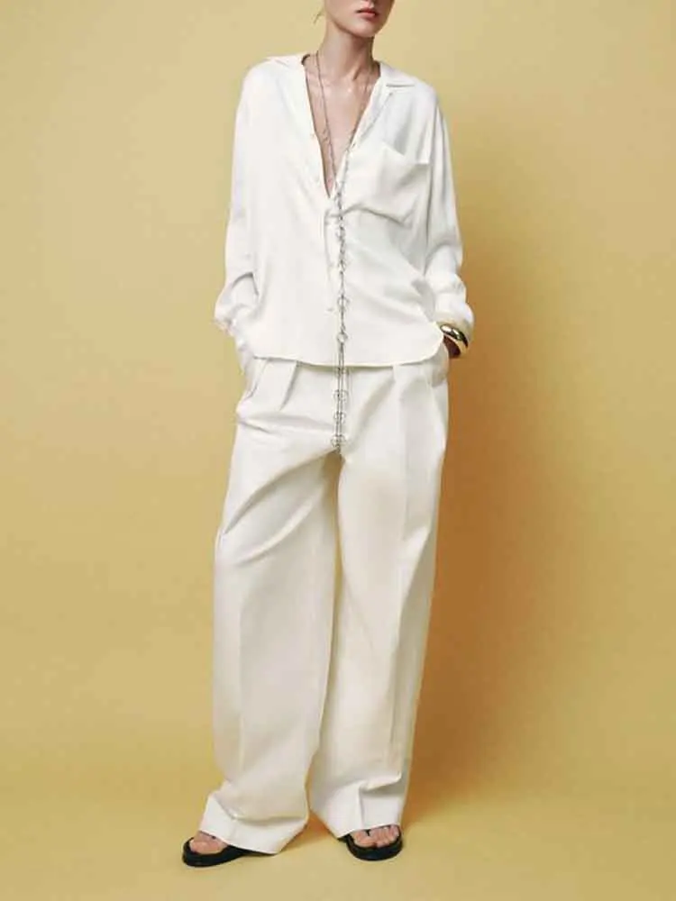 

European style new women's fashion versatile temperament French design series pocket decoration loose shirt