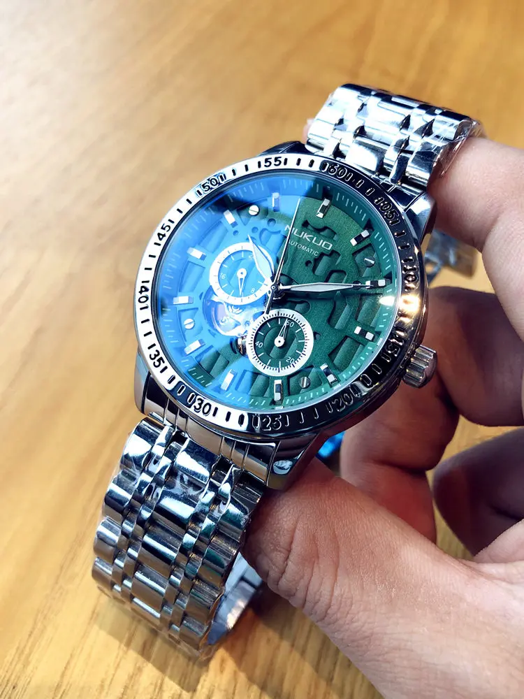 

Полностью автоматические механические мужские часы с турбийоном, водонепроницаемые, с люминесцентной стальной браслетной застежкой, модные деловые часы от известного бренда.