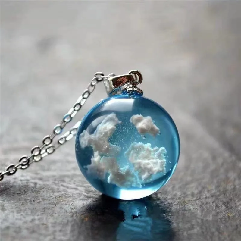 

New transparent spherical resin pendant, European and American luminous planet blue sky and white cloud necklace