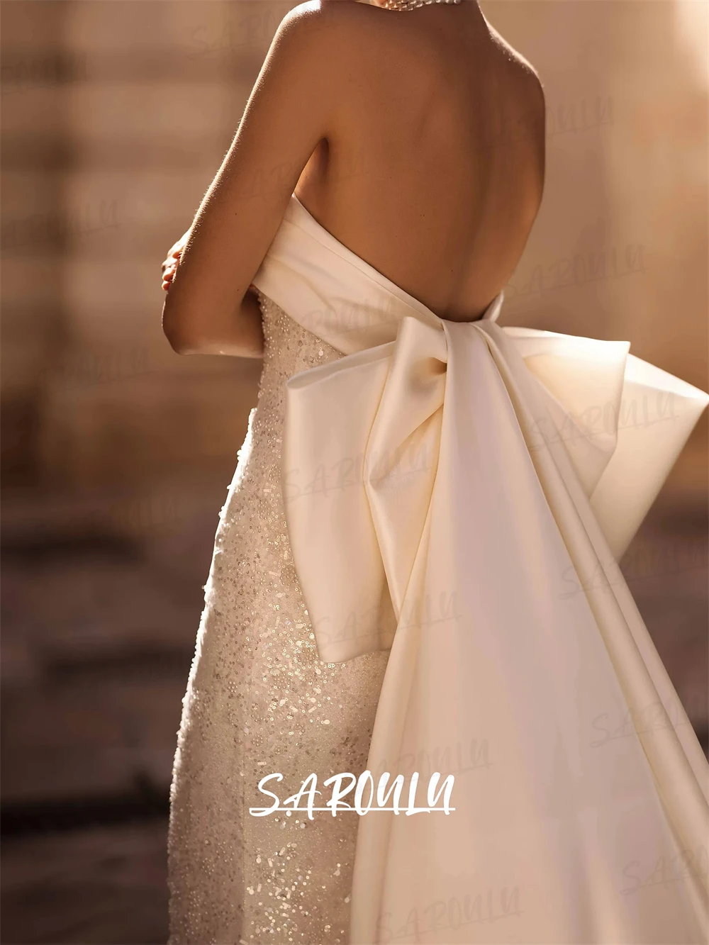 Abito da sposa da donna lucido senza spalline con strascico a fiocco Abiti da sposa lunghi a sirena affascinante Abito da sposa di lusso personalizzato