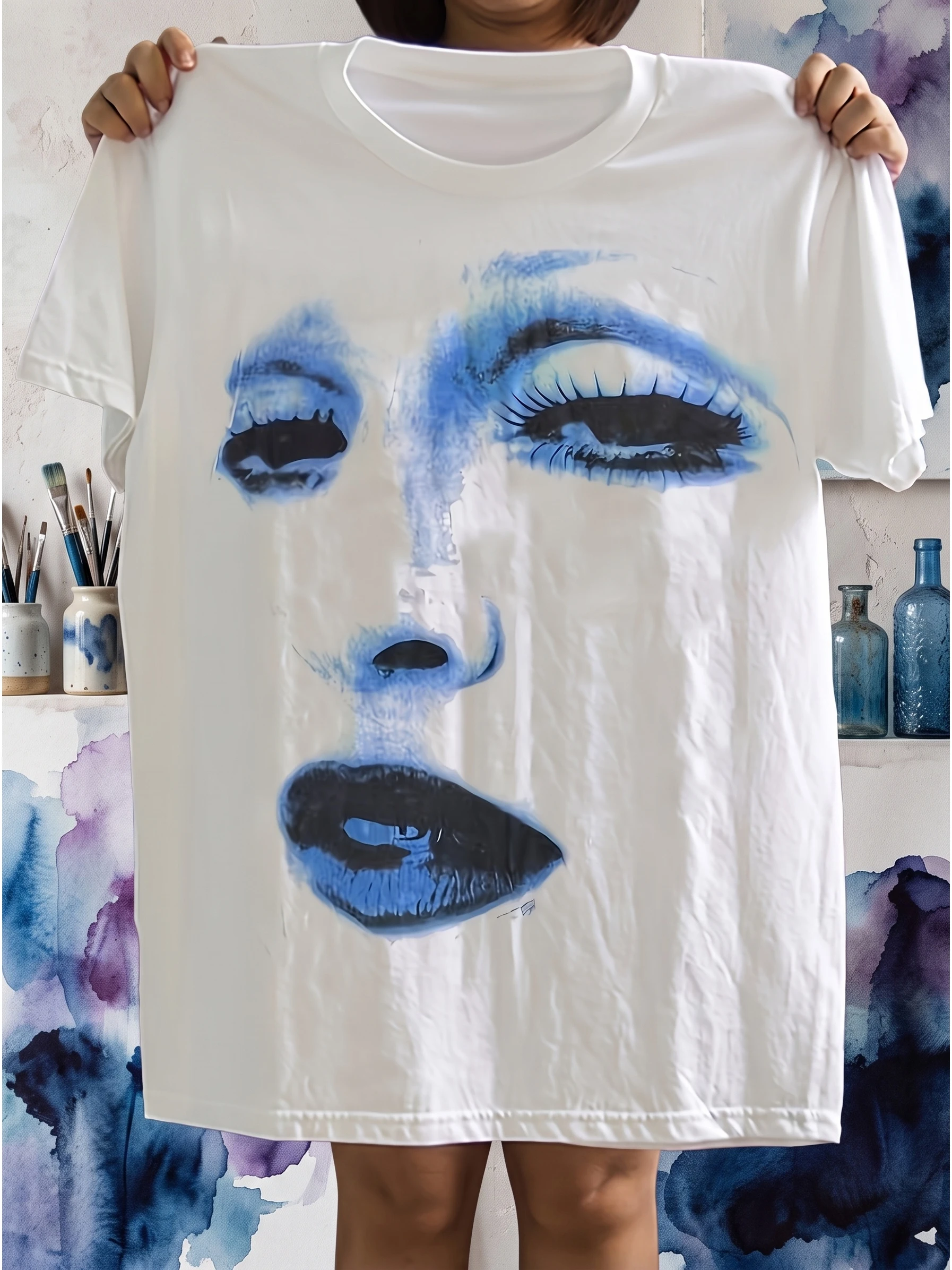 Neutral round neck T-shirt featuring Madonna's iconic image, white and blue lips, and classic makeup logo T-shirt