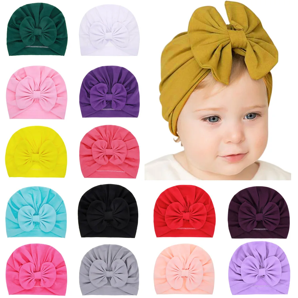 Śliczne Bownot Baby Turban Solid Color dziewczynek chłopców Beanie czapki kapelusz noworodka czapka dla niemowląt czapki elastyczne maluch Headwraps