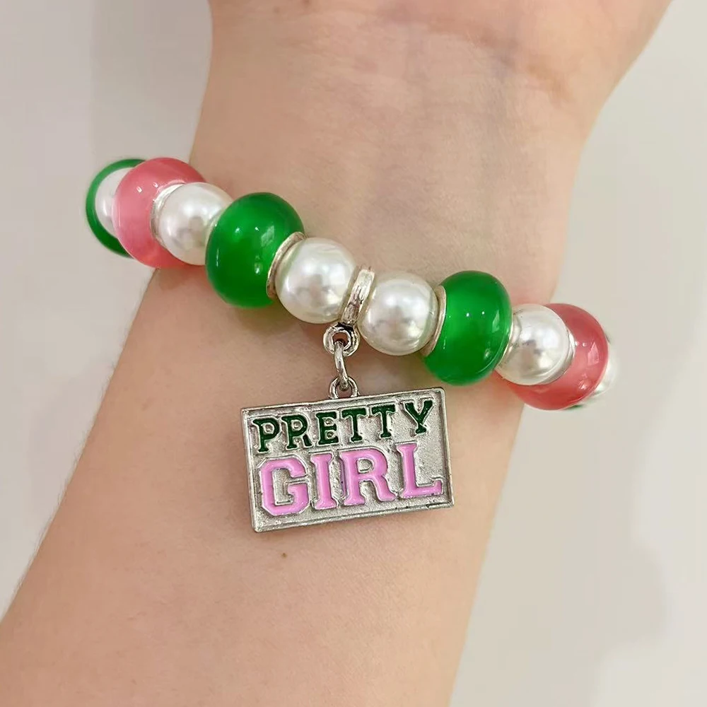 Pulsera elástica Alpha con colgante de chica bonita