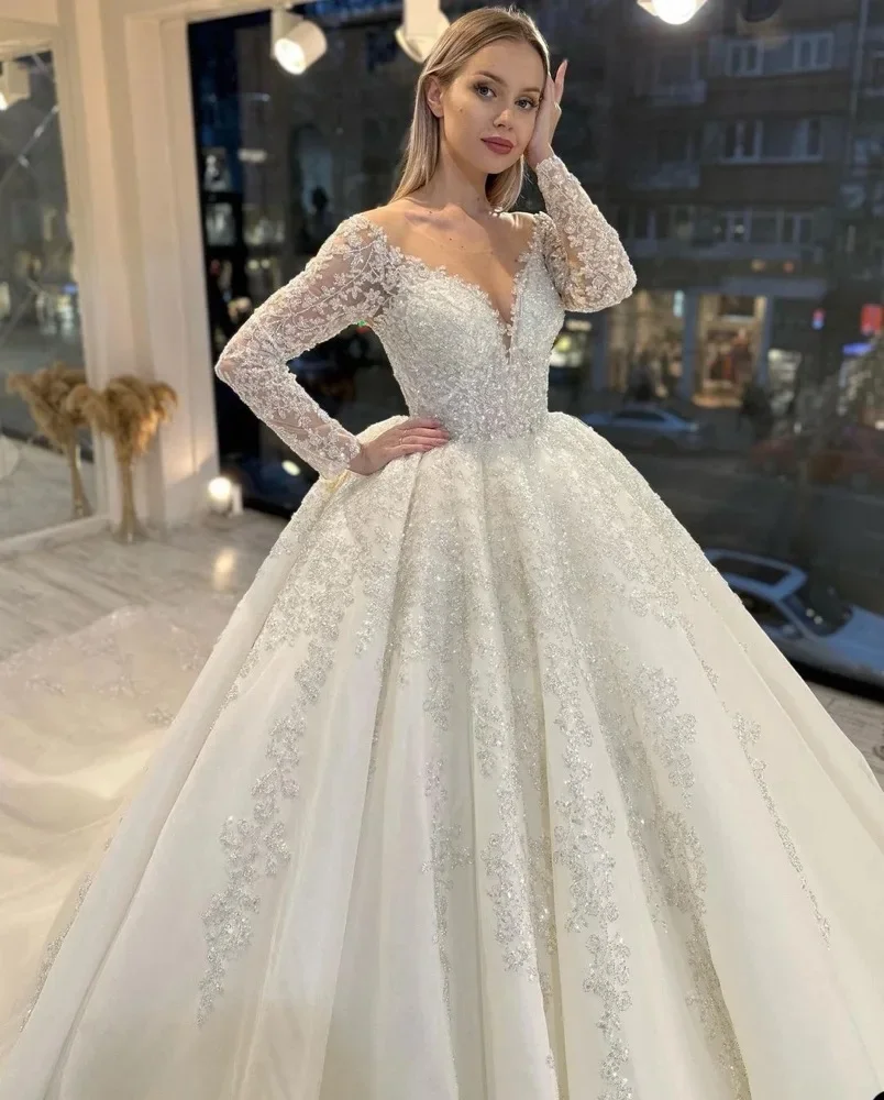 

Flavinke Customized Luxury A-Line Wedding Dresses Women Sequins Appliques Bridal Gown O-Neck Long Sleeves Sweep Train Vestido