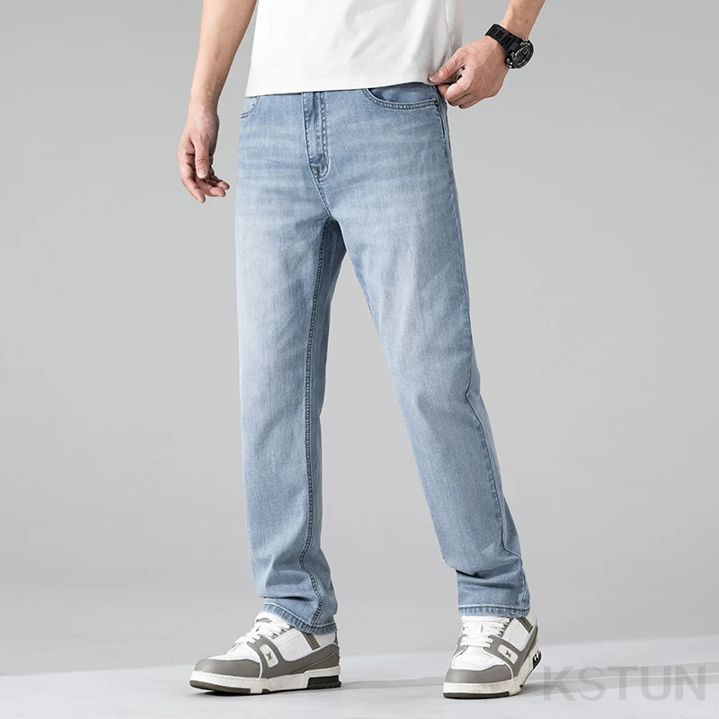 جينز طويل جدًا للرجال طويل القامة مستقيم أزرق فاتح كاجوال للأعمال بطول كامل ملابس رجالية قابلة للتمدد بطول ممتد
