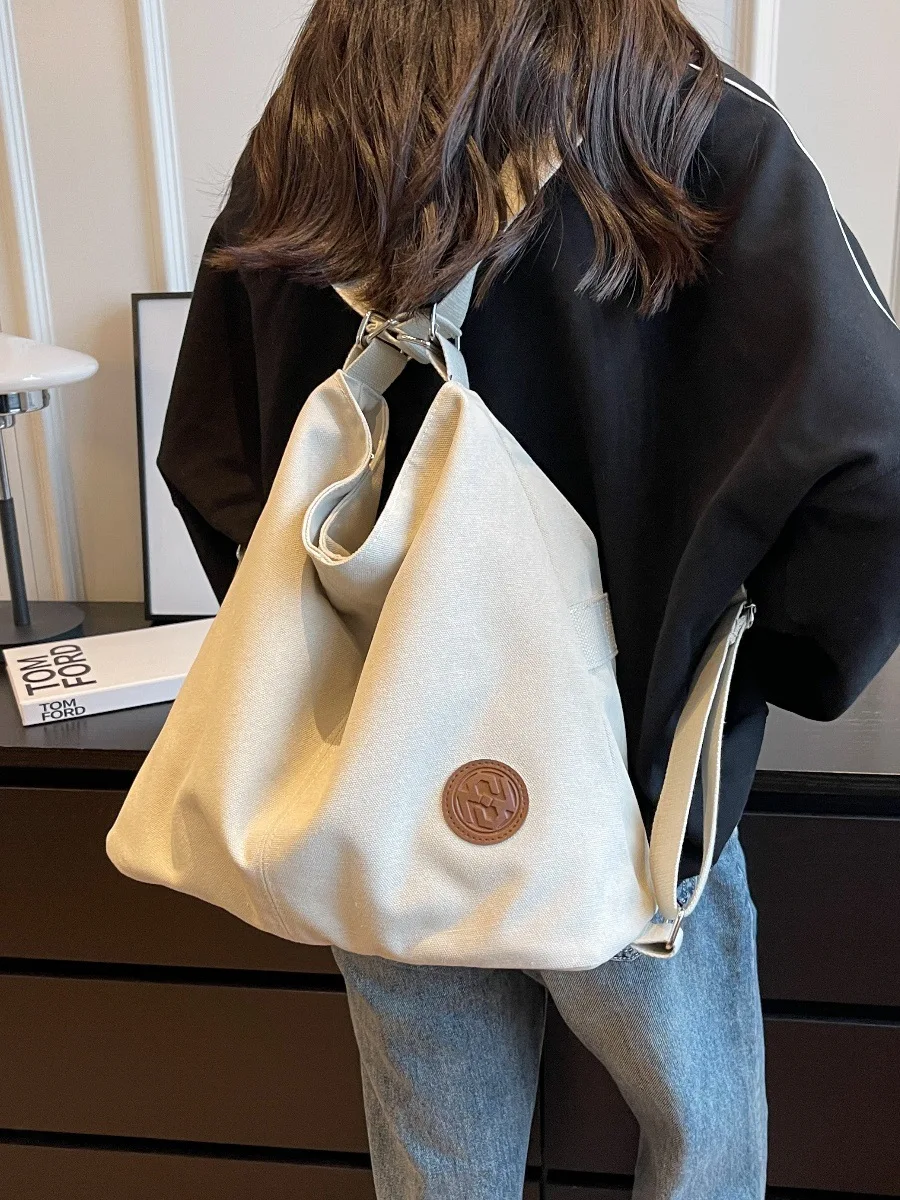 Lightweight and fashionable bag for women, new high-capacity tote bag, dual-purpose backpack, canvas commuting bag