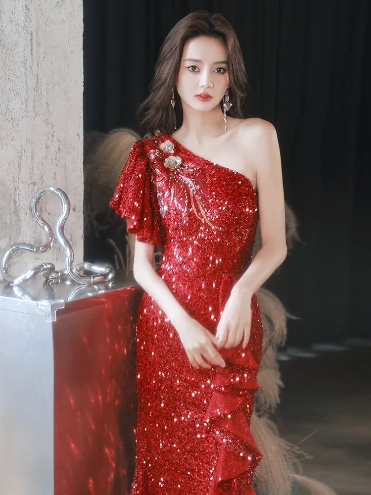 Red one-shoulder host heavy industry light luxury niche and sparkling dress for a cocktail party