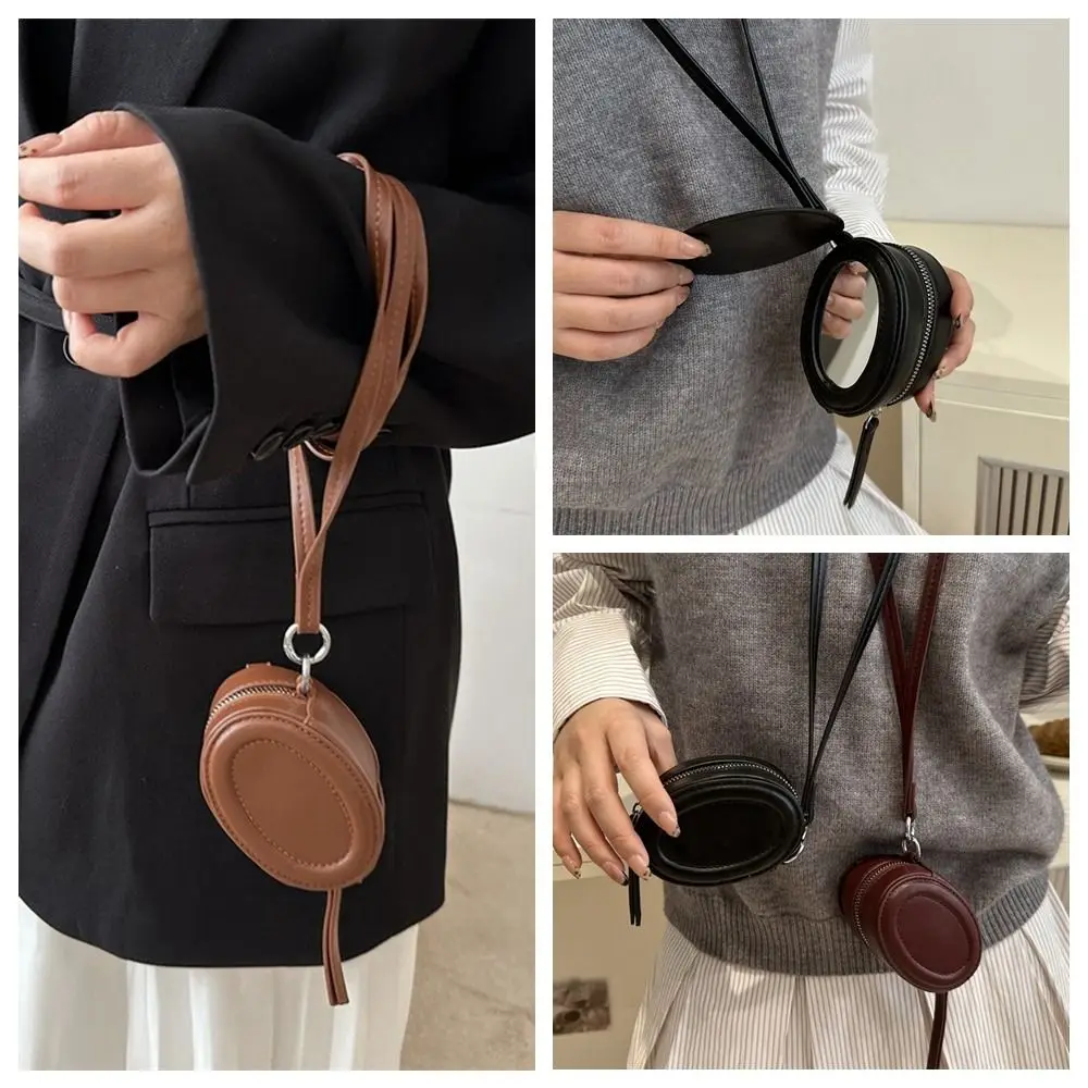 

Ins PU Leather Hanging Neck Coin Purse Oval with Makeup Mirror Earphone Bag Mini Round Lanyard Wallet Travel