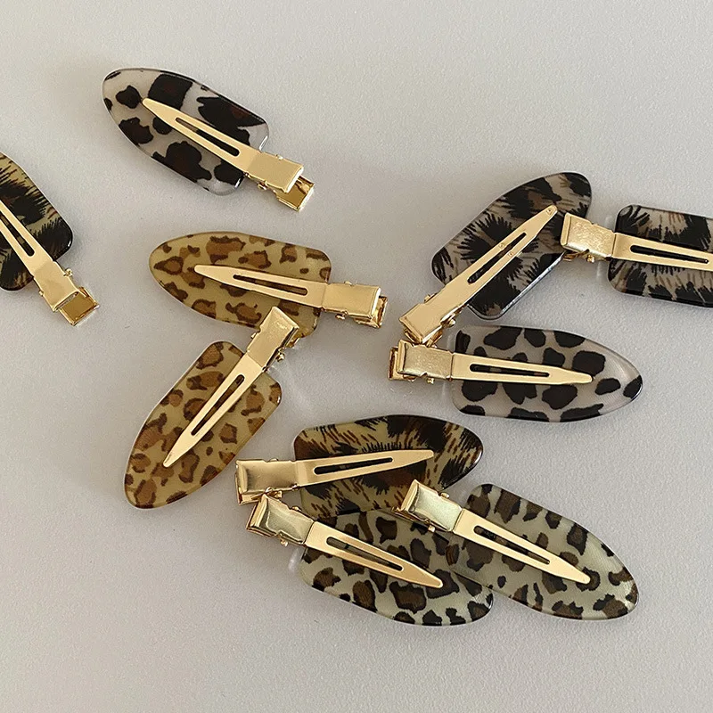Korean version of retro fashionable leopard print seamless oval hairpin personalized versatile makeup edge clip hair accessories
