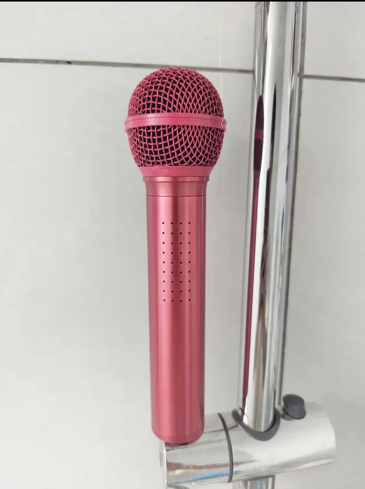 

Microphone , singing Gold, black, and red appearance