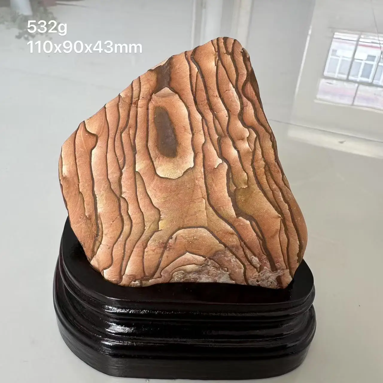 

The new 100% natural wood grain stone ornament includes a wooden base for home decoration from Guizhou