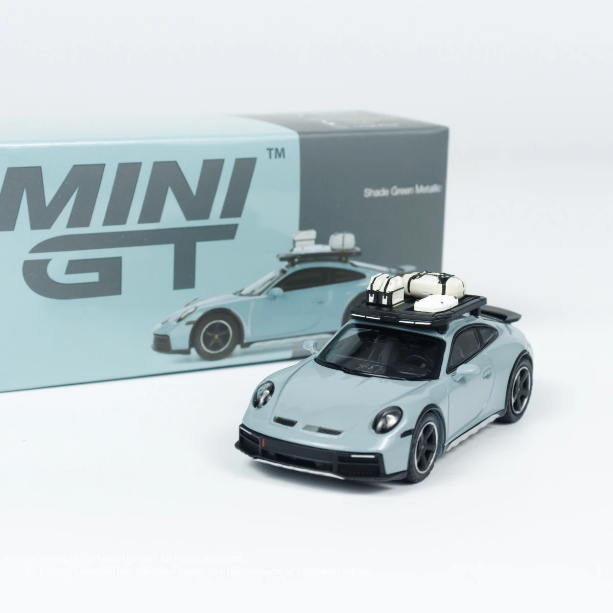 

Модель автомобиля MINIGT 1:64 Dakar Shade Green Metallic