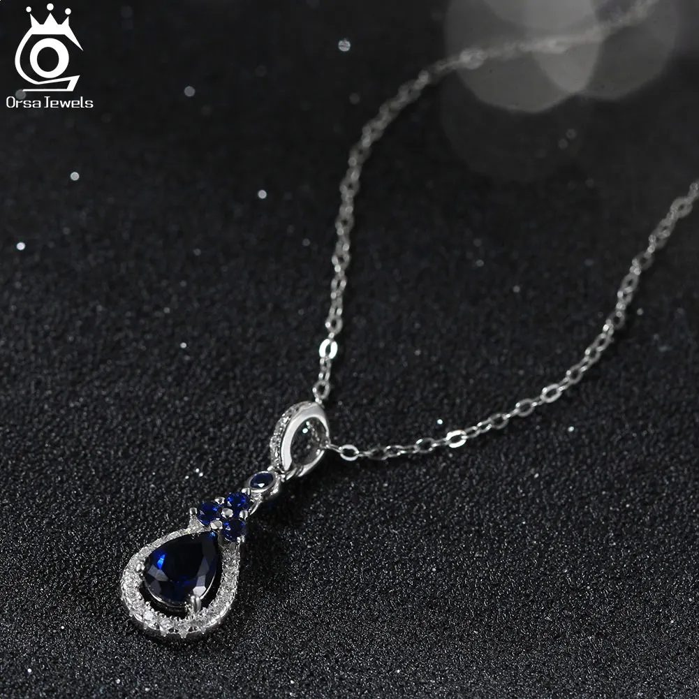 

ORSA JEWELS Элегантное ожерелье с сапфировым кулоном в форме капли воды, сверкающее ожерелье из 100% стерлингового серебра 925 пробы с цирконием LZN09
