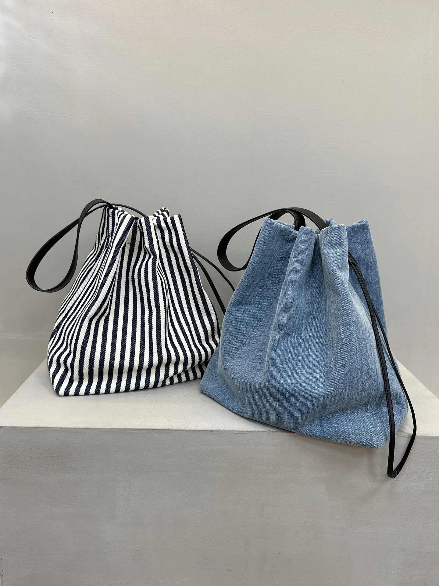 

Washed denim striped canvas bucket bag