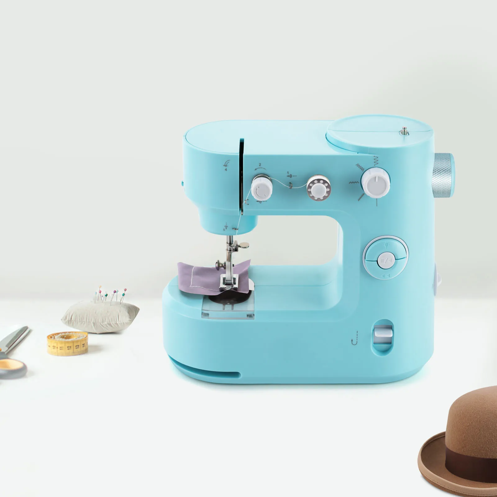 Sewing machine with free arm, super utility stitch