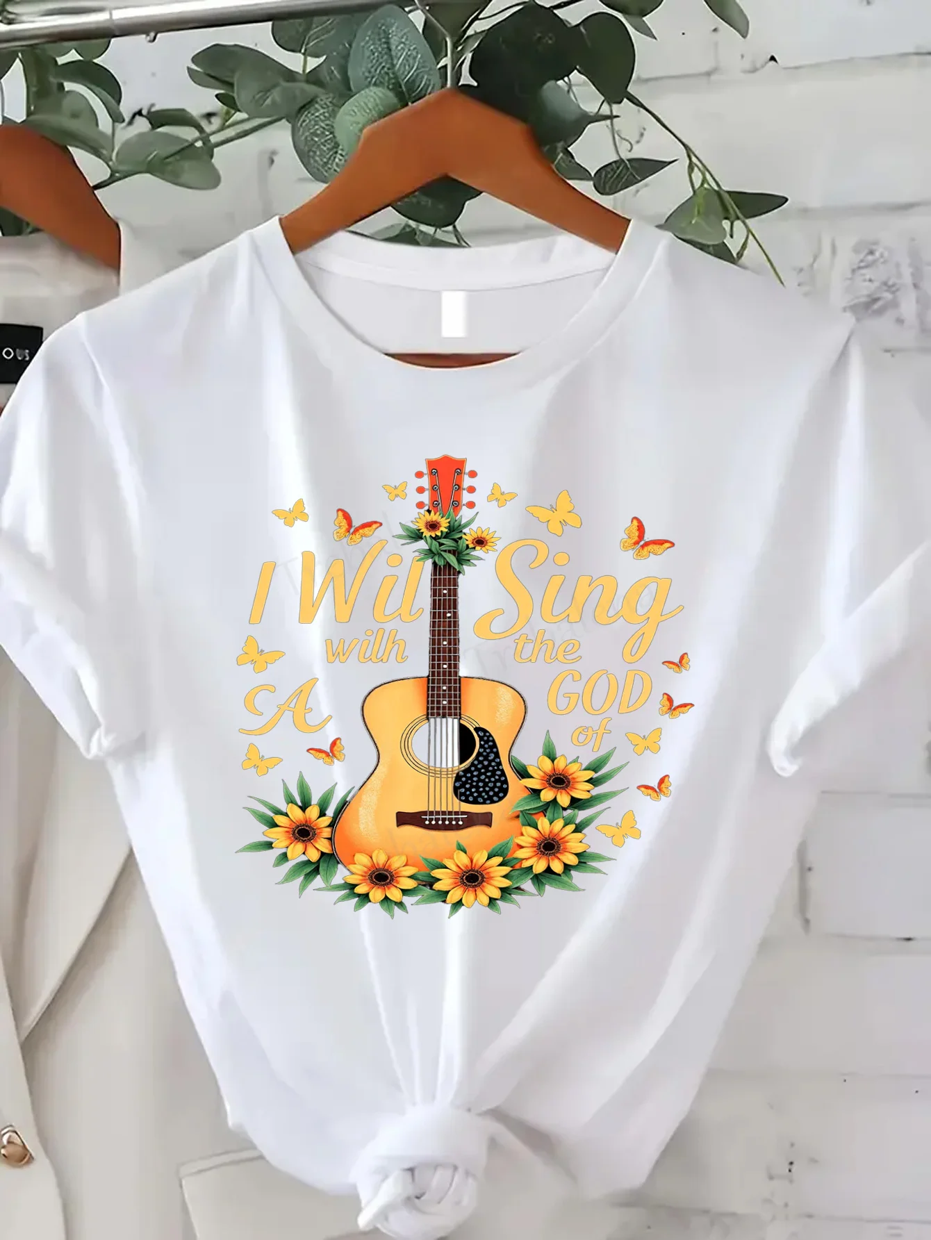 تي شيرت نسائي جيتار وعباد الشمس |   سأغني إله الموسيقى |   تي شيرت نسائي كاجوال