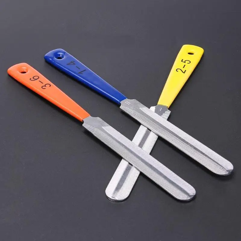 

3 different size gears, guitar pillow groove file, sanding wire, repair tool