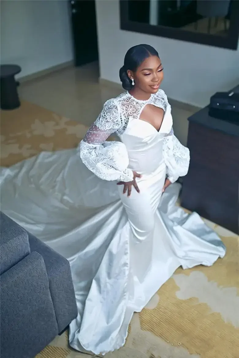 ชุดแต่งงานทรงเมอร์เมดแขนยาวแบบหรูหราประดับลูกไม้สไตล์แอฟริกันสำหรับเจ้าสาวไซส์พลัส