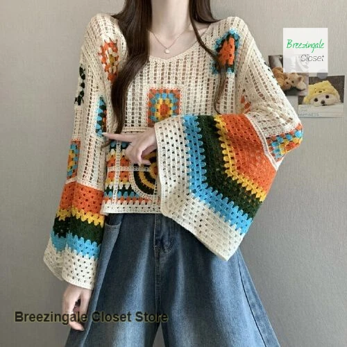 

Korean national style grandmother lattice trumpet sleeve sweater female spring new loose slim versatile temperament stacked top.