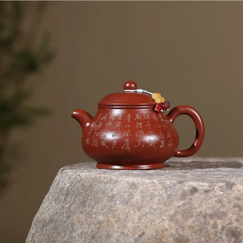 This Yixing purple clay teapot is handcrafted by master artisans. Its porous clay absorbs tea oils, enriching flavor over time.