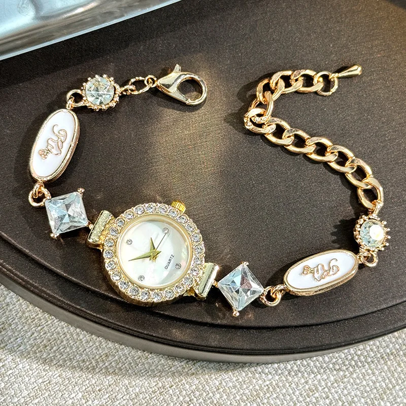 

Women Gold Tone Charm Bracelet Watch Round Full Rhinestone Bezel Mother Of Pearl Dial Quartz Wristwatch With Square Crystal & Enamel Oval Charms Adjustable Lobster Clasp Extension Chain Elegant Dress Jewelry Watch Birthday Gift for Ladies Daily Party