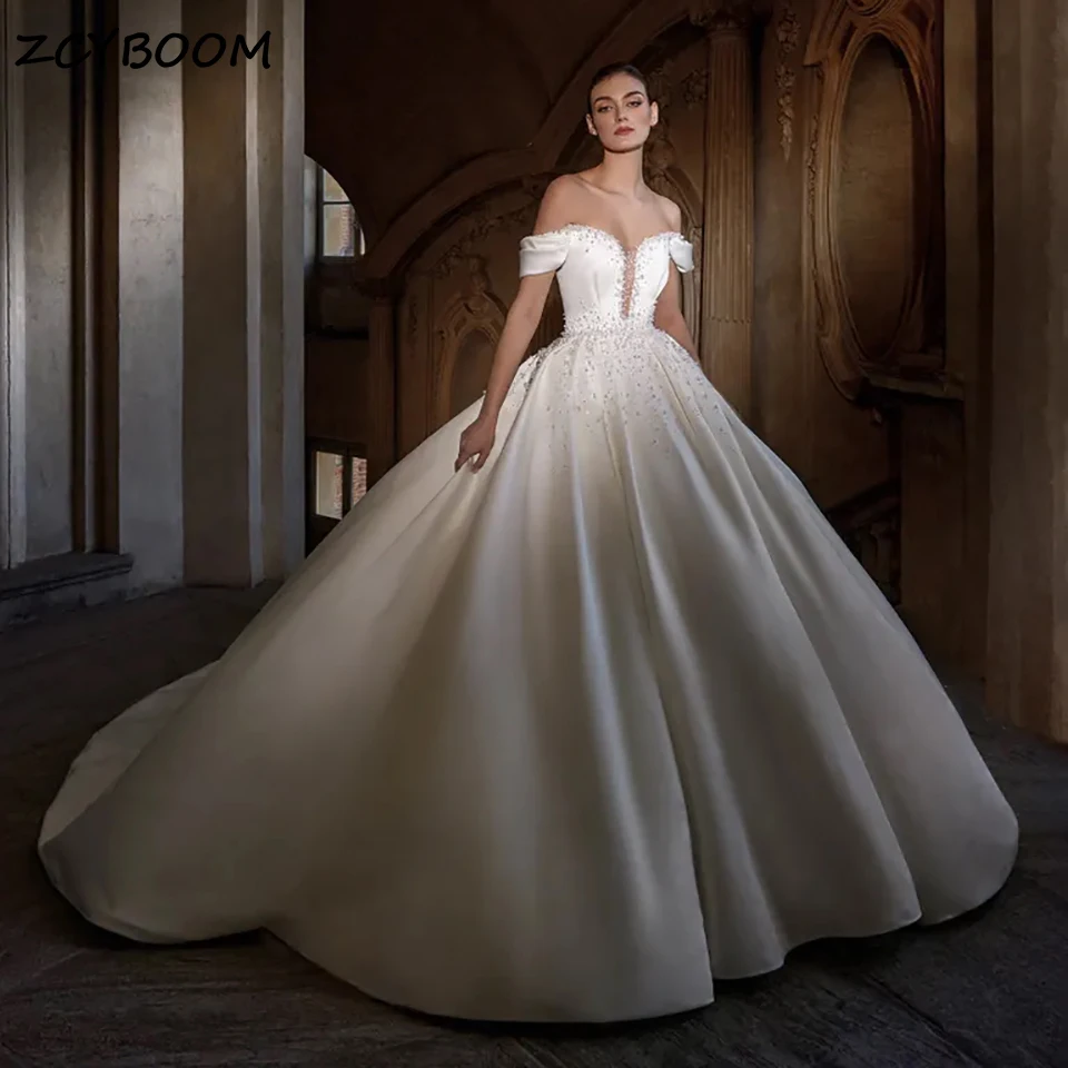 

Luxury White Off Shoulder Sparkly Pearls Beaded Wedding Dresses 2025 Sweetheart Ball Gown Backless Bride Gowns Vestido De Noiva
