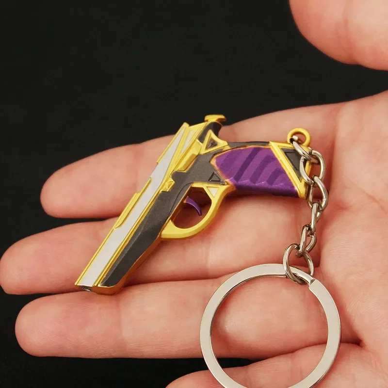 Mini llavero modelo de juguete de pistola púrpura y dorada de 5cm para colección, una mini pistola de juguete muy buena con llavero, accesorios Airsoft