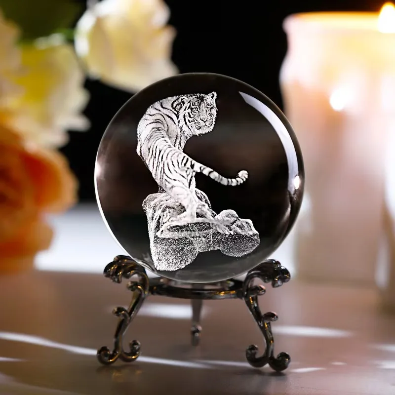 

A creative crystal ball desktop handicraft with 3D laser engraving of tiger, owl and deer patterns on a transparent crystal ball
