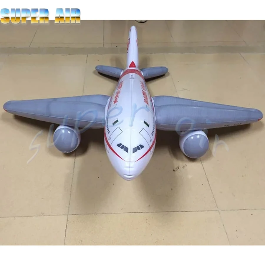 Decoración de modelo de diseño especial, avión blanco inflable gigante sentado en el suelo para espectáculo