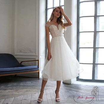 女性用ストラップレスウェディングドレス,カスタムスパンコールブライダルドレス,ノースリーブ,裸の肩,チュール,ビーチ,夏