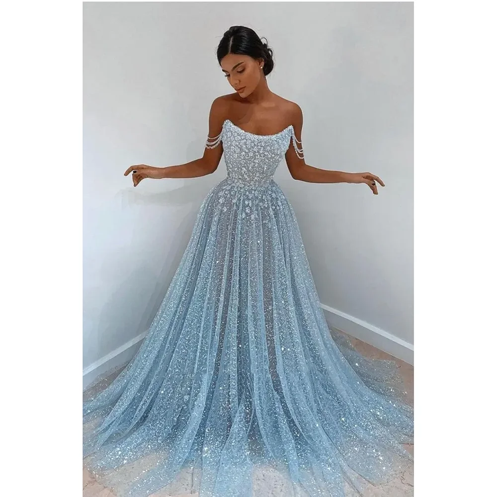 

Stunning Light Sky Blue Sequined Evening Dresses Sexy Spaghetti Strap Backless Sheer Tulle Blingbling Sequins Long Formal Occasi