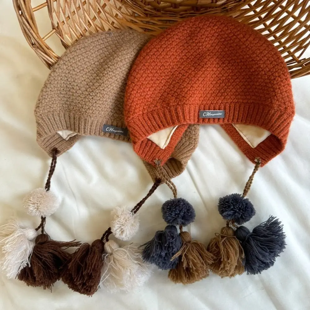 Gorro con borlas de estilo étnico para niños, gorro coreano de ganchillo hecho a mano para otoño e invierno, protección cálida para los oídos, gorro tejido para niñas