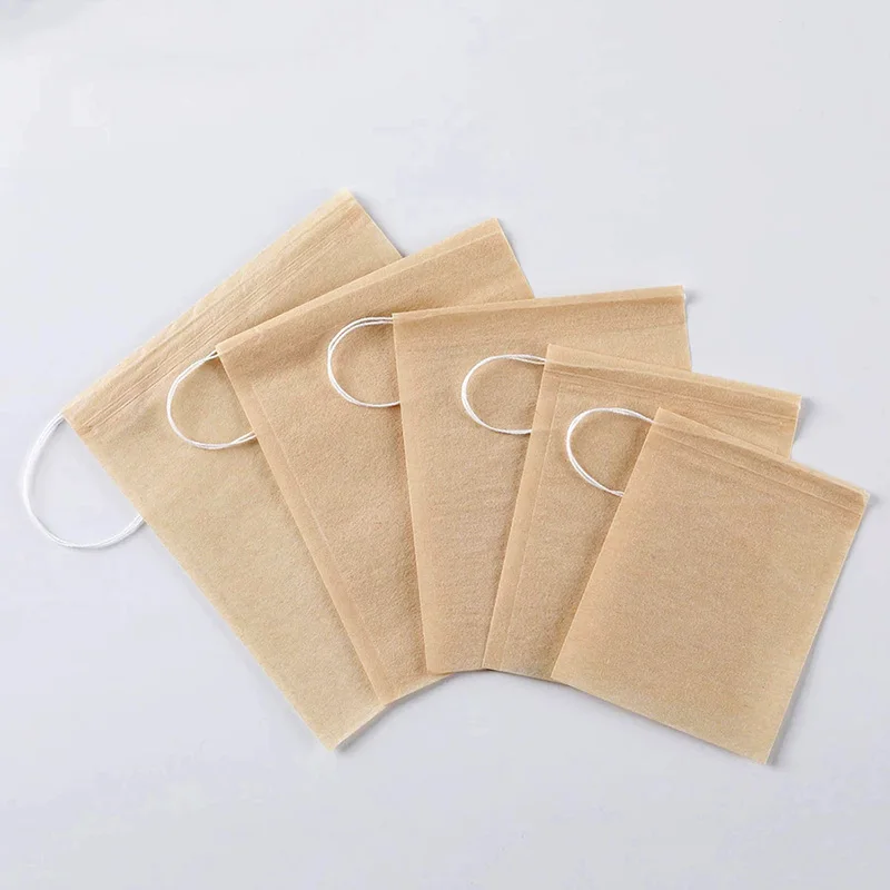 Sachets de thé en papier filtre biodégradable, sachet de thé de qualité alimentaire, écologique, avec cordon de serrage, poudre de feuille libre, passoire de phytothérapie, 100 pièces