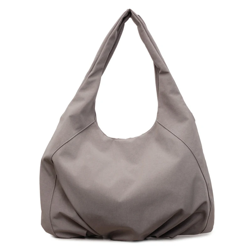 

Large-capacity lightweight dumpling bag for women2026New sports and fitness yoga bag, versatile horn bag, shoulder handbag