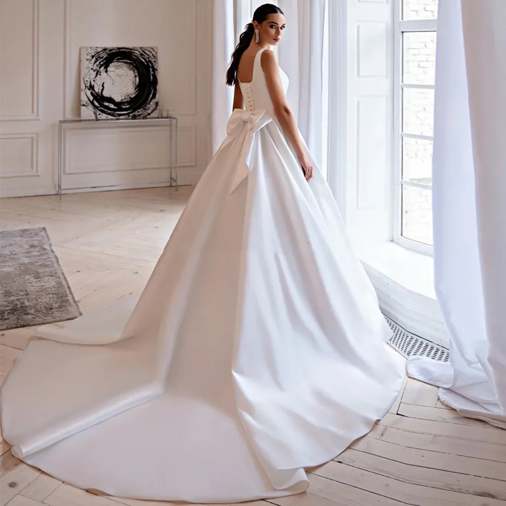 Abiti da sposa eleganti svasati 2024 abito da ballo con collo quadrato perle abito da sposa senza maniche cintura con fiocco abito da sposa classico con lacci