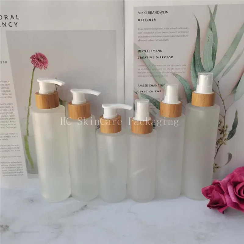

whosesale high quality Containers for lotion transparent frosted glass bottle bamboo pump lid empty toner cosmetic containers