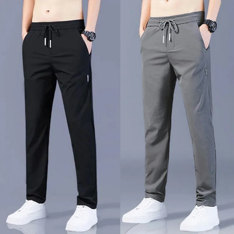 2023 pantaloni Casual da uomo primavera estate tinta unita moda tasca Applique pantaloni da lavoro maschili a figura intera Pantalon dritto