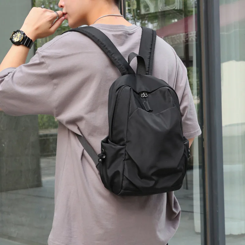 Mini Mochila pequeña de lona para hombre, bolso escolar de hombro negro, impermeable, de diseñador, para viaje y Deportes, a la moda, 2023
