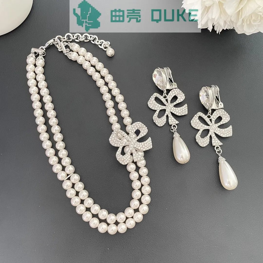 Bow knot full of diamonds, four leaf clover, water droplets, pearls, light luxury, high-end feeling necklace, earrings for women