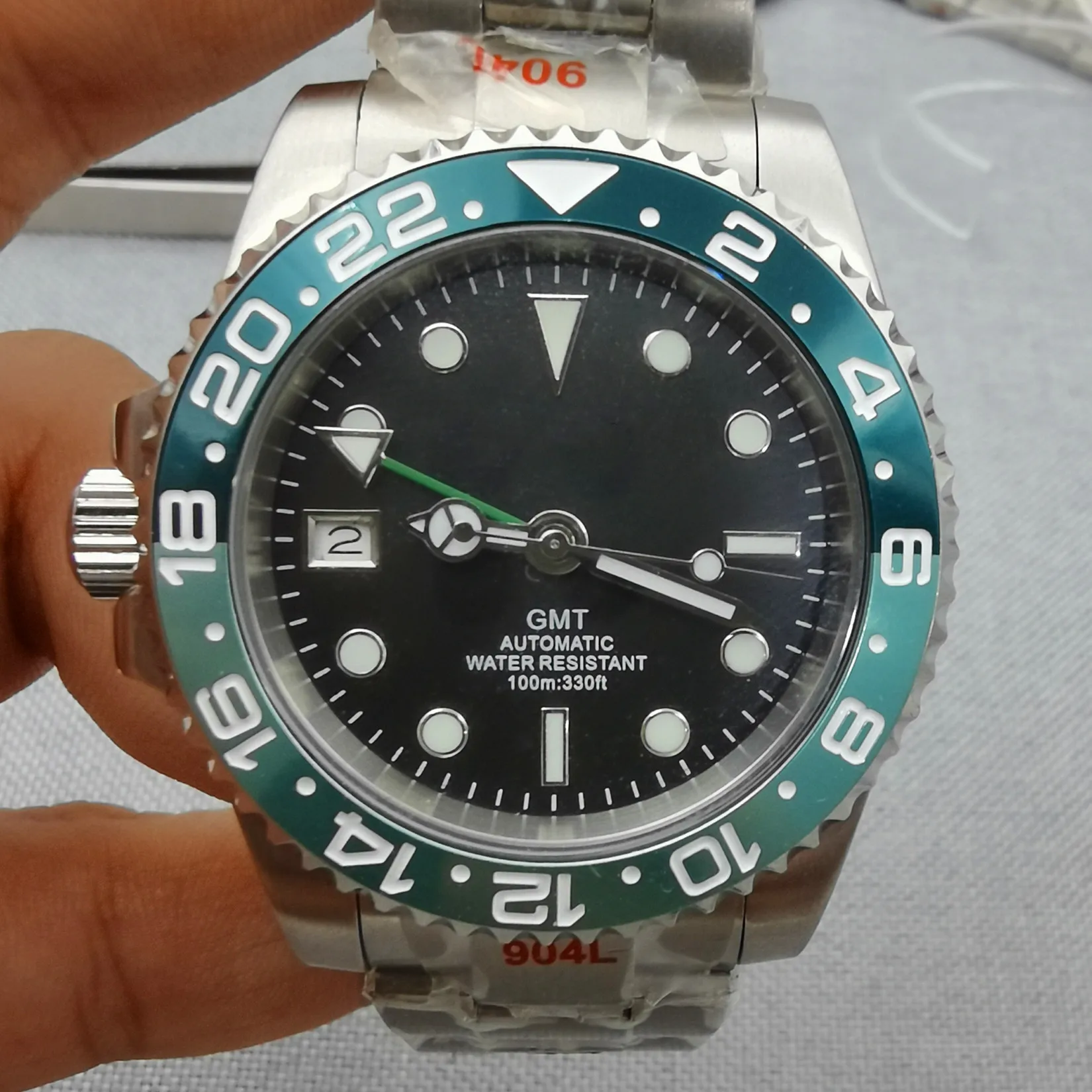 New Gmt Dual Time Zone Displays A 100-Meter Waterproof Left Crown Stainless Steel Watch Japan Nh34 Greenwich Automatic Movement
