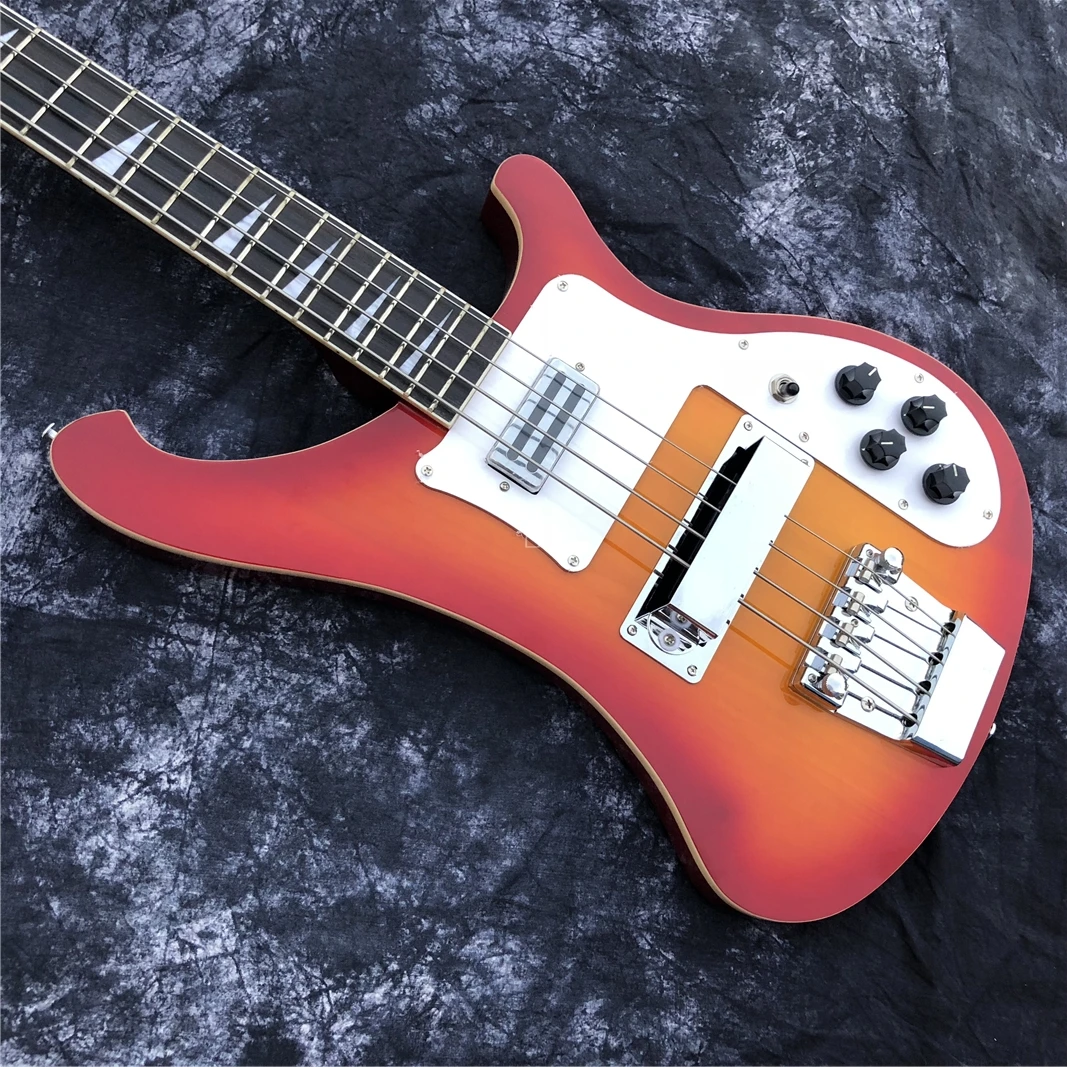 This is a professional 4-string bass electric guitar with a sunset color changing bright face. It has a beautiful tone