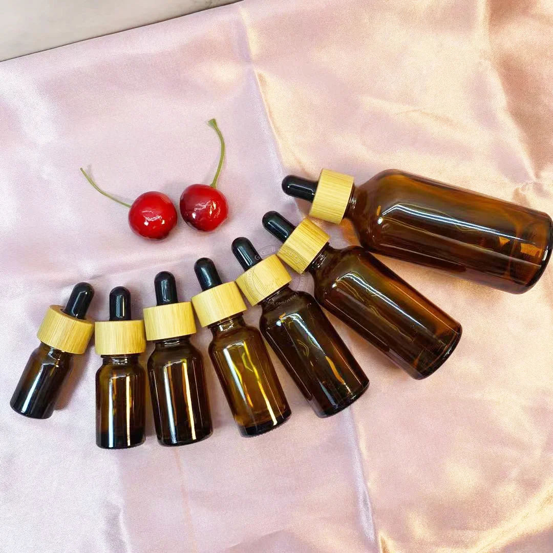 Whosesale frascos de garrafa conta-gotas de vidro âmbar/verde/azul/preto de alta qualidade com tampa de bambu pipeta para garrafas de perfumes cosméticos