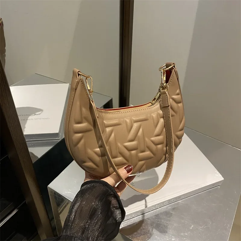 

Niche design three-dimensional indentation bag women's high-end striped shoulder underarm crescent bag
