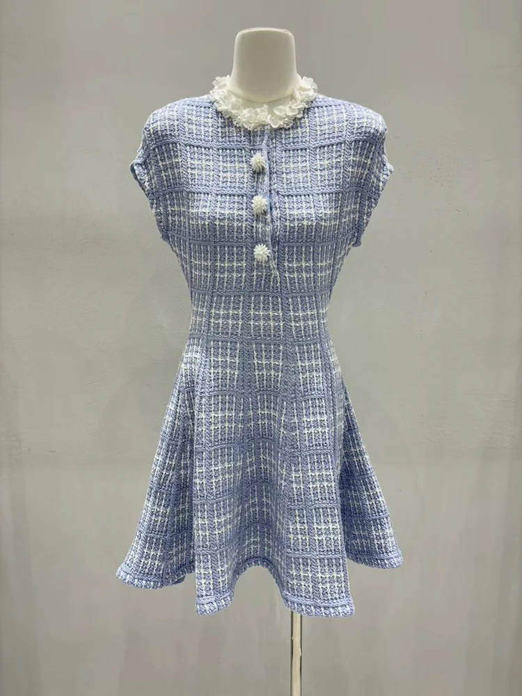 Color-block plaid knit dress; new-season Autumn 2026 women's dress featuring a round neck adorned with beaded petals.