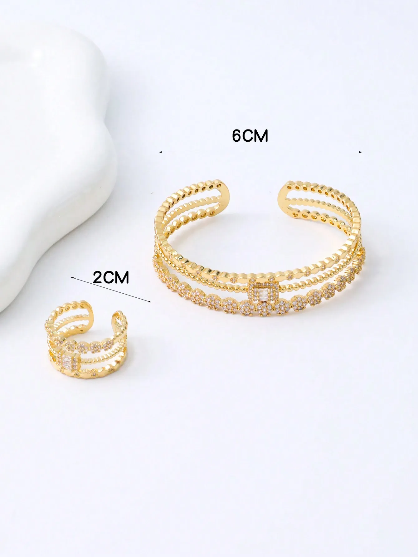 A set of women\'s new European and American 14K gold-plated copper retro hollow micro-inlaid zircon geometric bracelet ring set