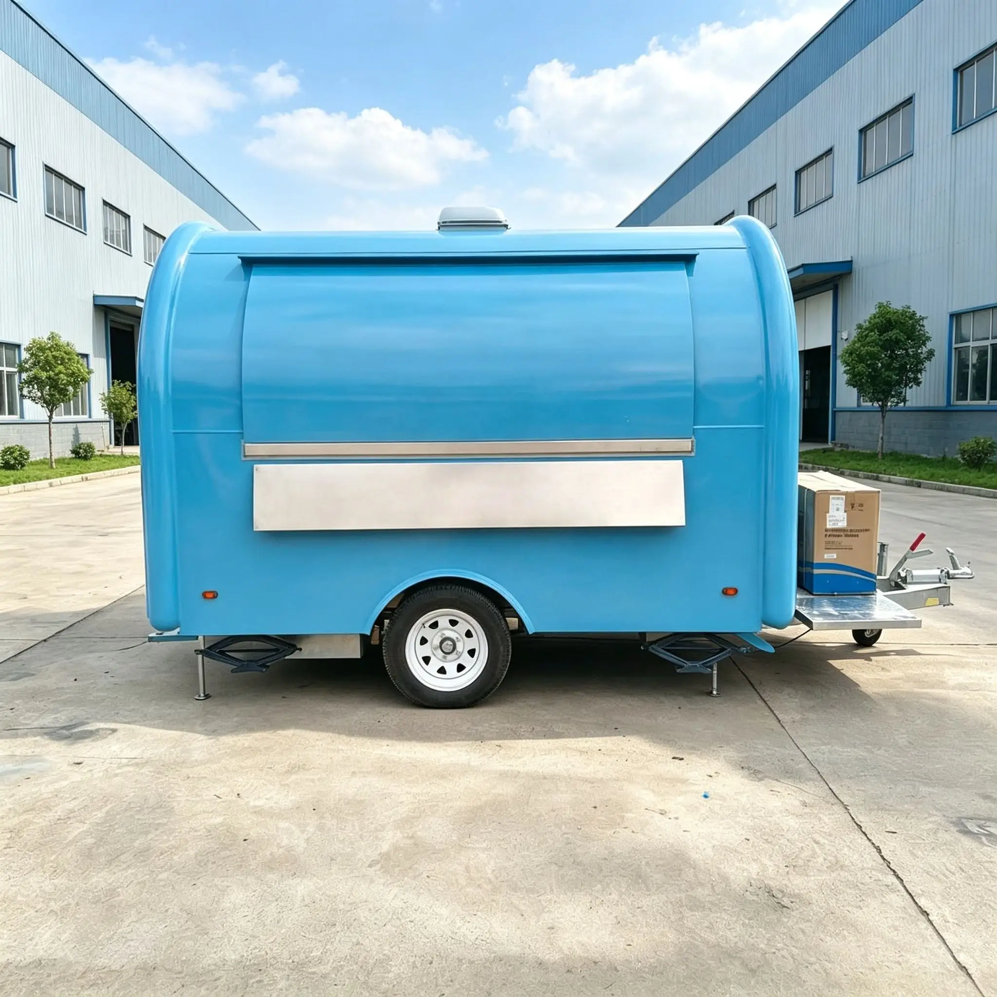 Compact Towable Food Trailer with Large Glass Display Window, Rounded Body and Flexible Interior for Mobile Food Service