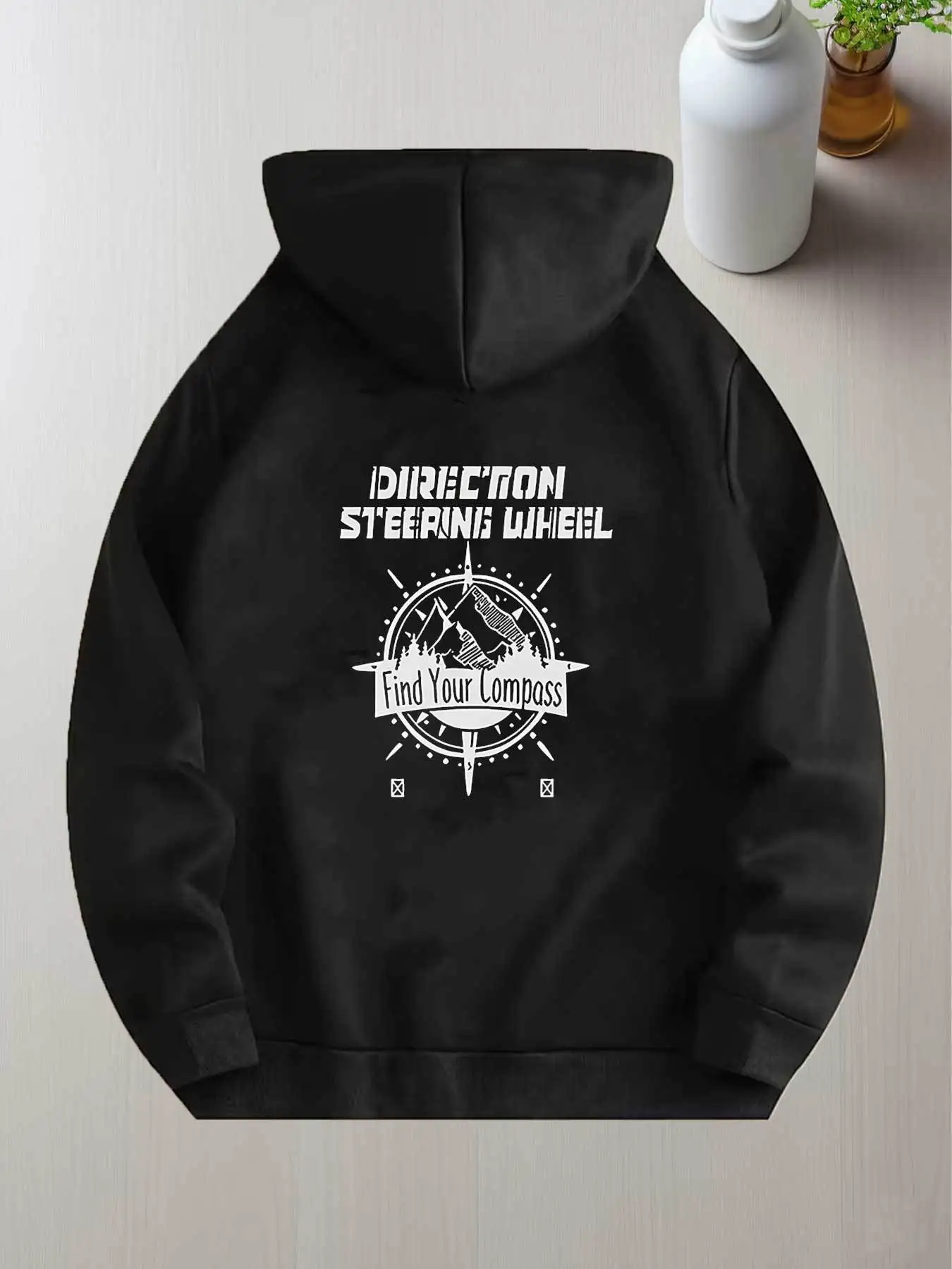 Men's Black Hoodie Features an Artistic Mountain Pattern with Arrows and Vibrant Directional Elements. This Unisex Essential Item Is Perfect for Gifting and Is One of the Most Popular Products. It's Soft, Breathable, and Lightweight.
