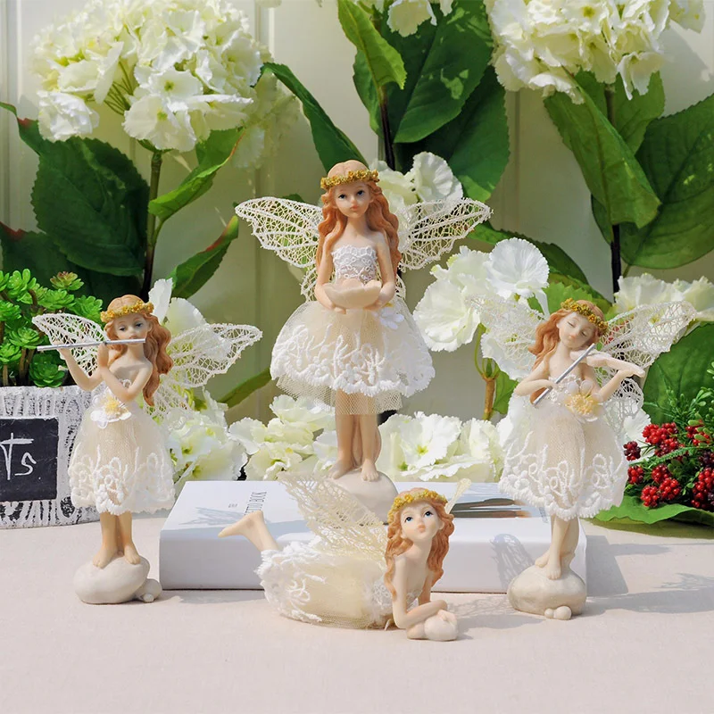 

Little girl in a white dress with wings. Pastoral style resin doll. Craft ornaments Home decor Winged beauty sculpture statue.