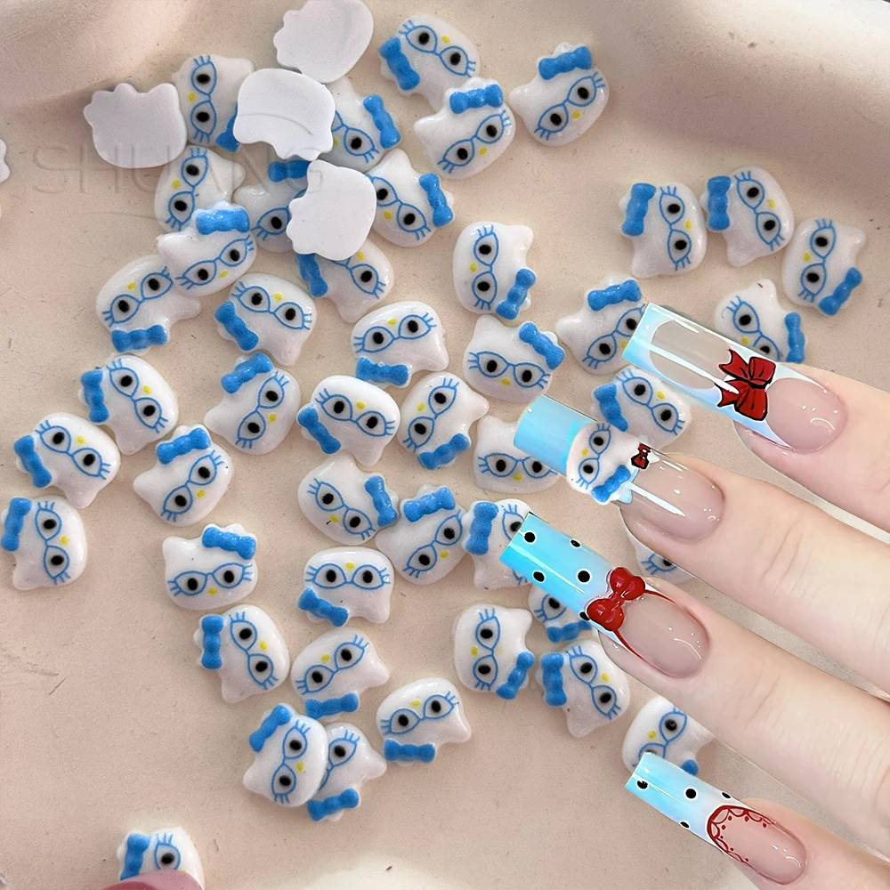 

50pcs 3D Blue Glasses Hello Kitty Nail Accessories Kawaii Cartoon Y2k Kitty Cat Nail Art Charms Resin Bowknot Kitten Nails Decor